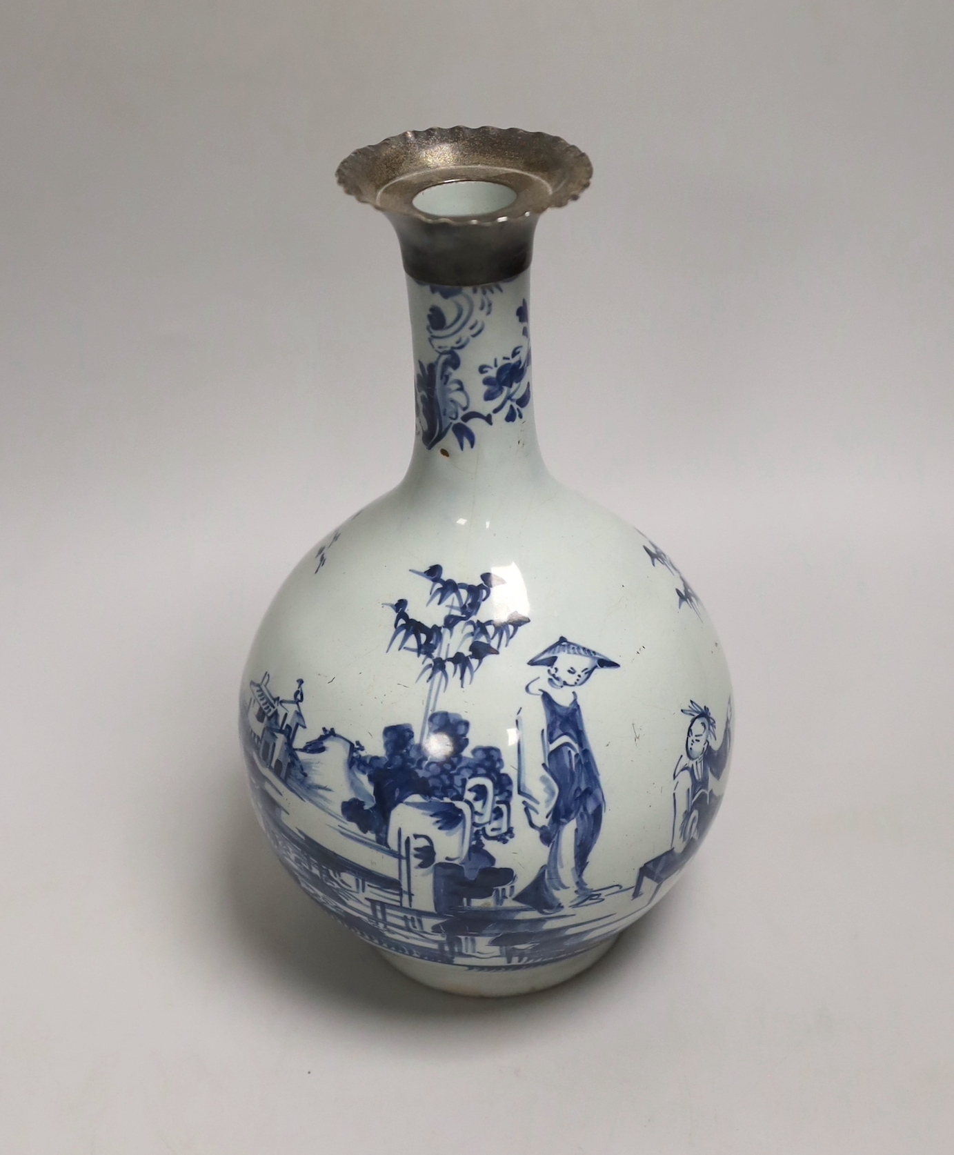 An 18th century English delft bottle vase with silver collar, 23cm